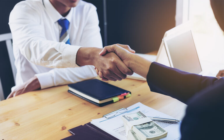 Business woman signing a loan for investment, negotiation