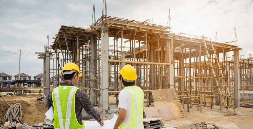 Two construction workers at a construction site